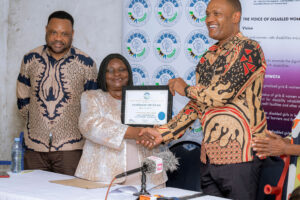 Read more about the article President Minja presents Membership certificate to Voice of Disabled Women.